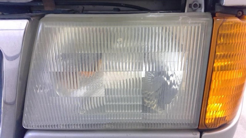Driver Left Headlight Composite Fits 97-07 FORD E150 VAN 1850935